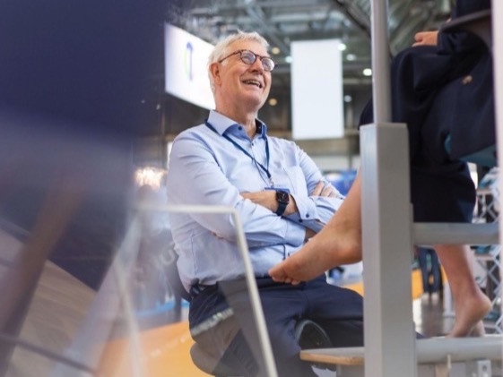 A practitioner being assessed on the Orthostand M30 at OTWorld 2026 in Leipzig