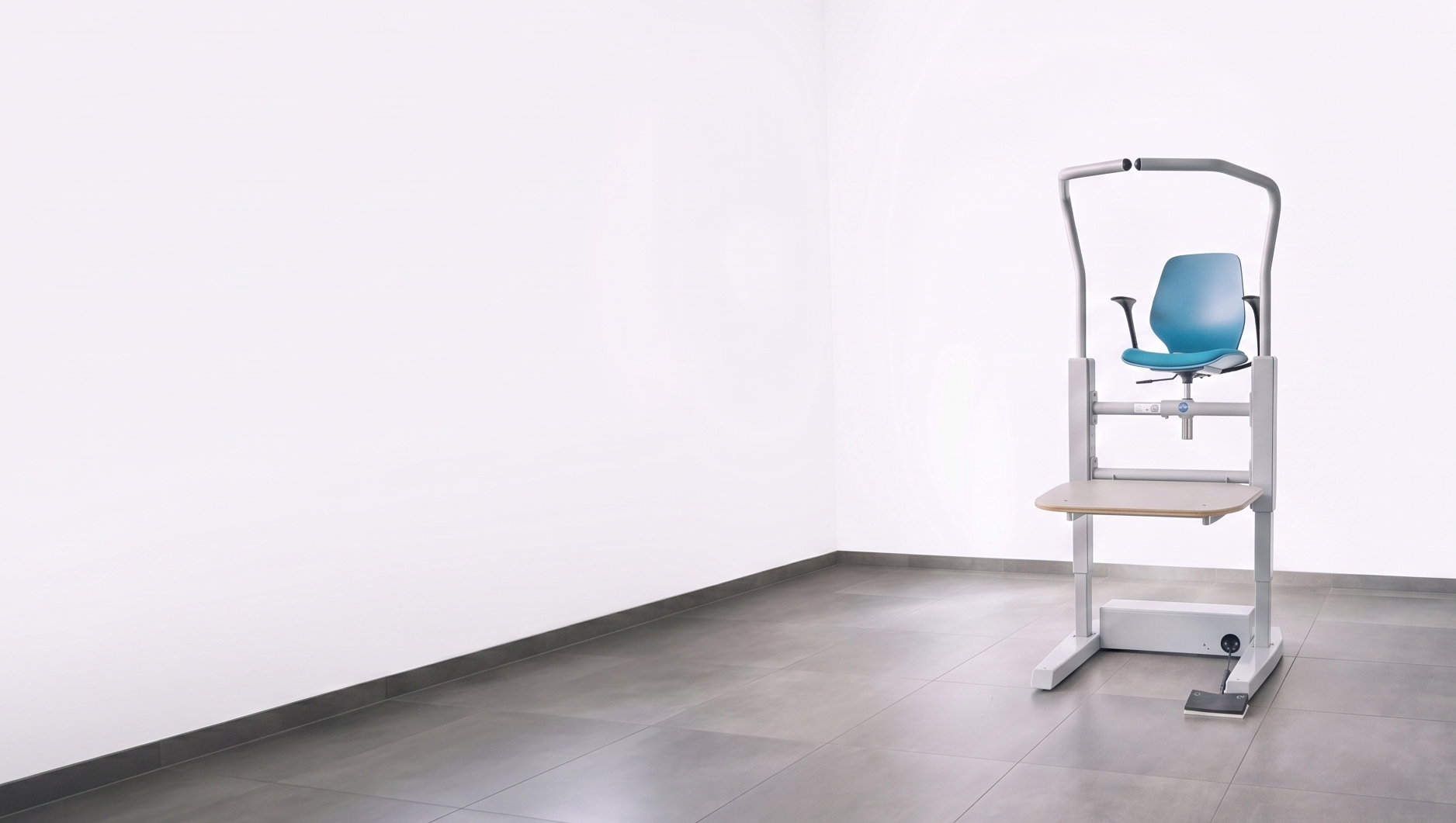 Orthostand M30 workstation set up in a treatment room, raising the client to a comfortable working height